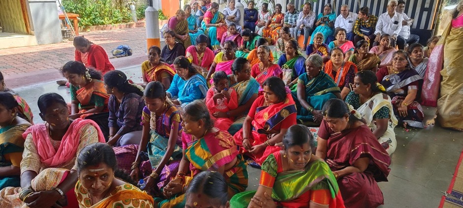 Pouring sanctified waters over deity