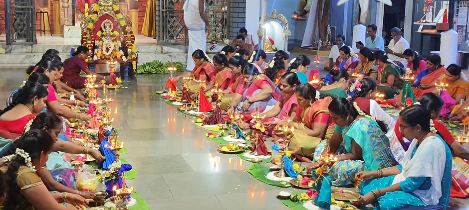 Devotees performing lamp worship
