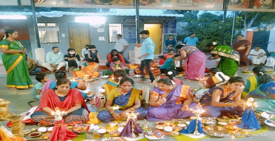Women performing the poojai